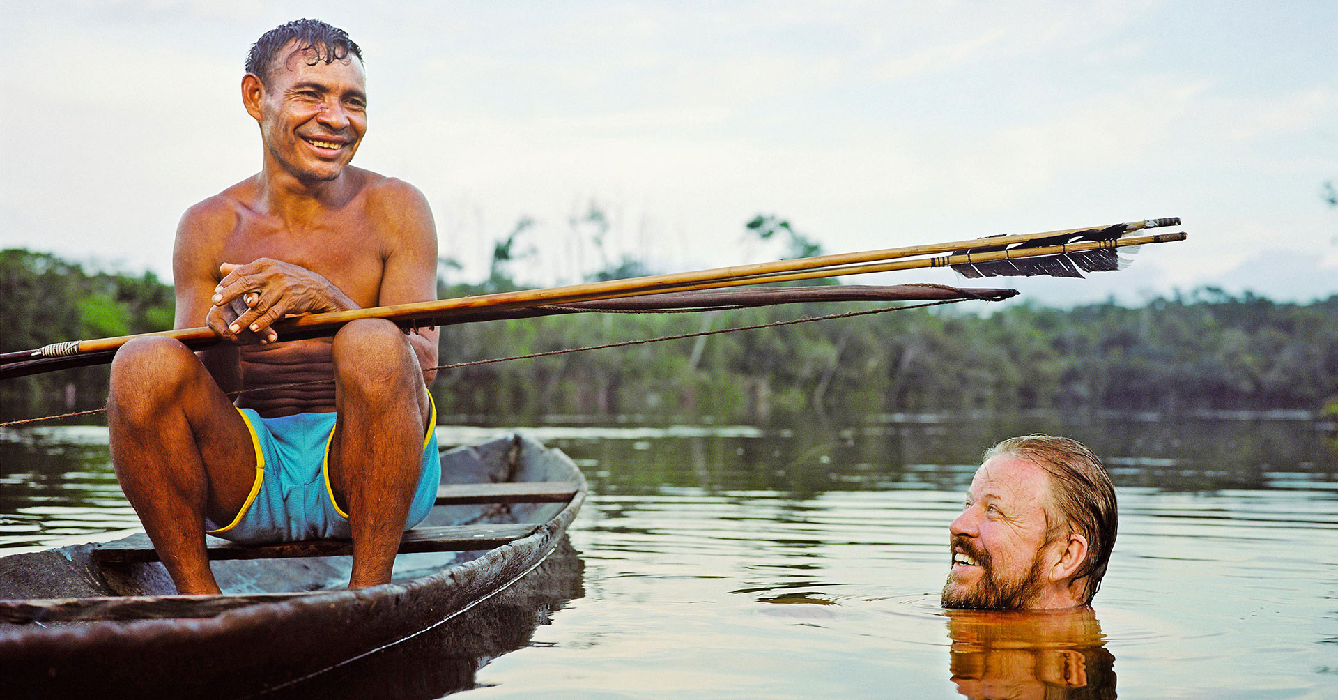 Daniel Everett, right, learnt the language of the remote Piraha tribe while living with them in the Amazon rainforest MARTIN SCHOELLER